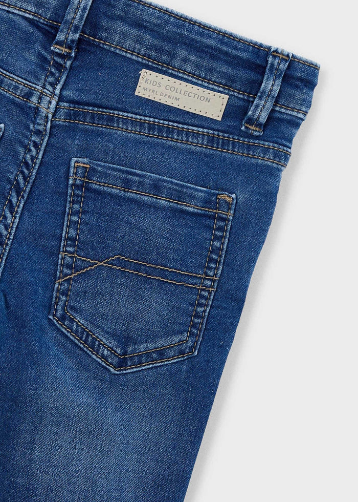 Closeup of Mayoral boys jeans showing waistband, pocket stitching, and stretch denim texture.