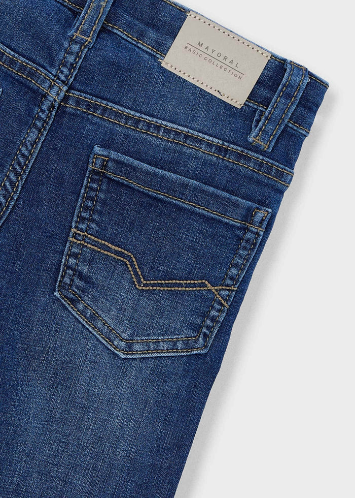 Closeup of Mayoral boys jeans in Dark Denim highlighting the denim texture and back pocket detail.