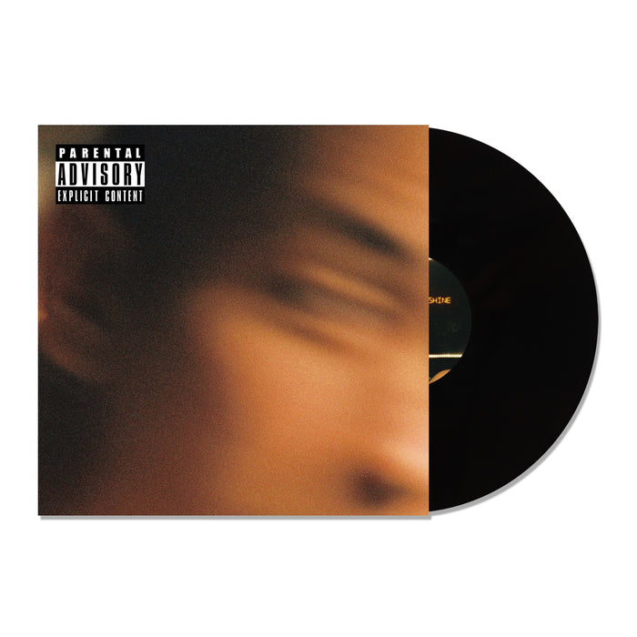 A Black Vinyl record partially slides out of its sleeve, which displays a blurred close-up of a face, the Trophy Eyes Suicide And Sunshine title, and a Parental Advisory Explicit Content label in the top left corner.