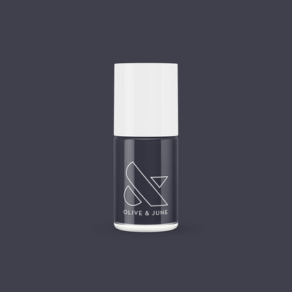 Olive and June 100% CHANCE nail polish bottle in deep gunmetal blue for smooth, long-lasting mani and pedicure looks
