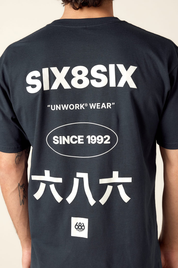 A person wearing the 686 Unwork Wear Authentic S/S Tee in mens black cotton, featuring white SIX8SIX, UNWORK WEAR, SINCE 1992, ÂÖ≠ÂÖ´ÂÖ≠ text on the back and a small circular logo at the bottom. Brand: 686.