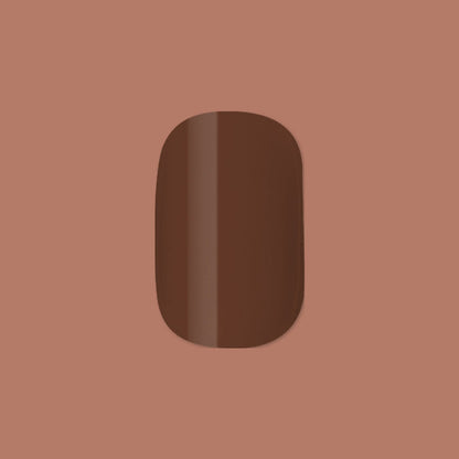 Americano | Short | Squoval - Tab Press-On showing a single glossy coffee brown false nail on muted brown background