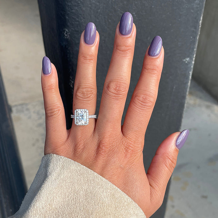 Hand with glossy muted purple manicure using Art Class polish in natural light showing smooth finish