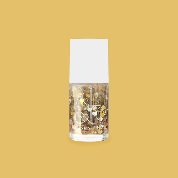 Clear nail polish bottle filled with silver and gold heart confetti glitter from Biggest Fan by Olive and June