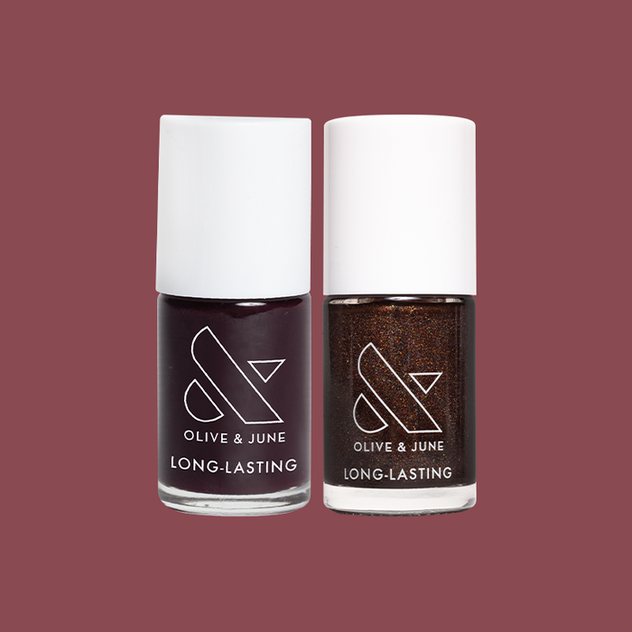 Two bottles of Olive and June long-lasting polish in dark cherry and chocolate tones from Bittersweet Cherry set