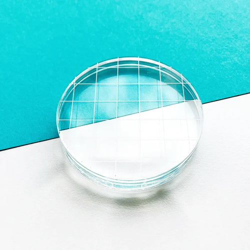 Catherine Pooler - Acrylic Grid Stamping Block - 3-1/4" Round. 3.25" Clear acrylic grid. Available at Embellish Away located in Bowmanville Ontario Canada.