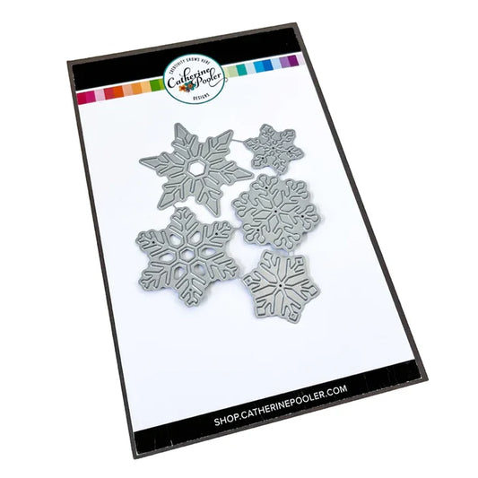 Catherine Pooler - Dies - Snow Many Flakes. You can never have too many snowflakes. So bring on the Snow Many Flakes Dies! This set of 5 graduated size snowflake dies will give you lots of options to layer on the snow! Available at Embellish Away located in Bowmanville Ontario Canada.