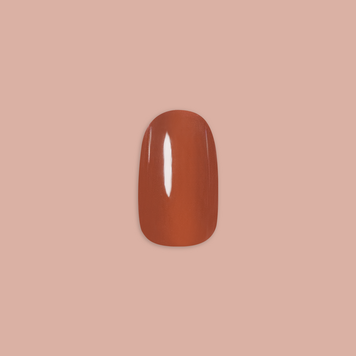 Cocoa Chrome - Press-On | Short | Round single false nail in dark chocolate with shiny chrome finish on neutral background
