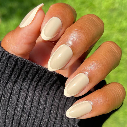 Coffee French | Almond | Medium press-on nails with a neutral asymmetrical French mani in a medium almond shape for easy at-home manicure