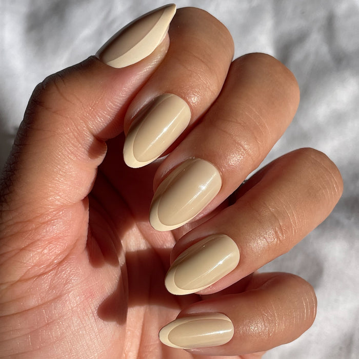 Coffee French | Almond | Medium medium almond shaped press-on nails with a neutral asymmetrical French mani for easy at-home manicure