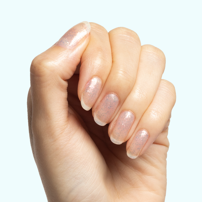 Diamonds Are a Mani’s Best Friend iridescent sheer polish on natural nails for a sparkling, long-lasting at-home manicure look