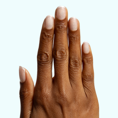 Diamonds Are a Mani’s Best Friend sheer iridescent polish on natural nails for a subtle sparkling at-home manicure look