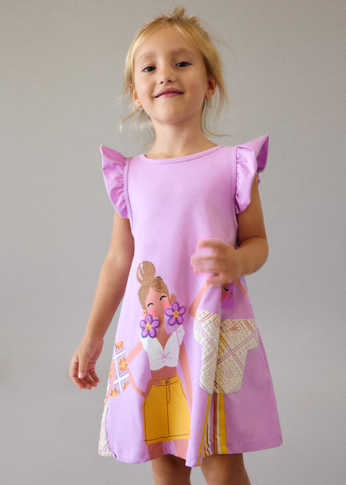 Girl wearing Mayoral Lilac graphic dress for a playful everyday outfit look.