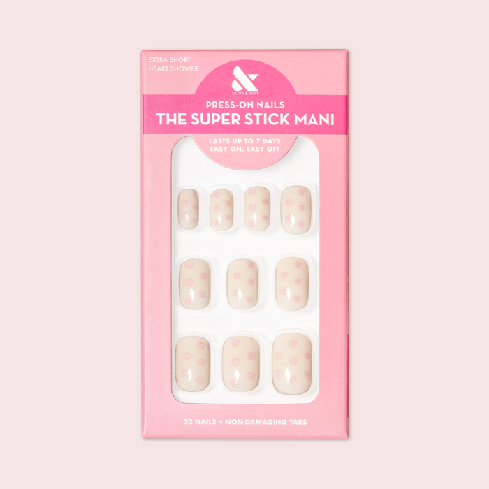 Heart Shower | Extra Short | Squoval - Tab Press-On neutral press-on nails with tiny pink hearts in pink packaging on white background