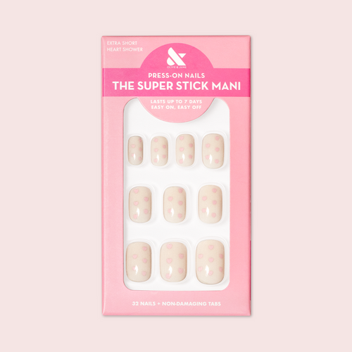 Heart Shower | Extra Short | Squoval - Tab Press-On neutral press-on nails with tiny pink hearts in pink packaging on white background