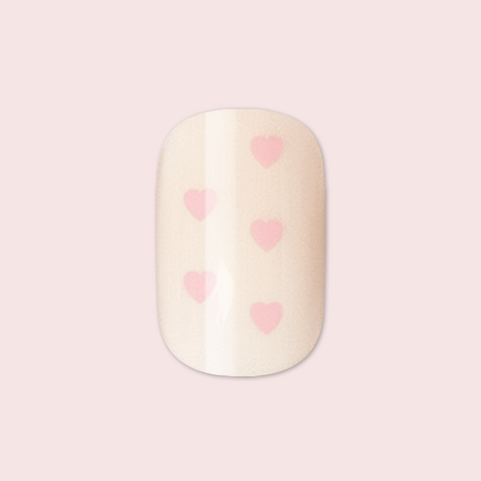 Heart Shower | Extra Short | Squoval - Tab Press-On neutral false nail with soft pink heart details on pale background