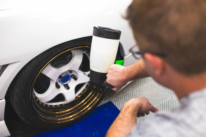 Person using an iK Multi Pro 2 360 on a tire.