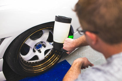 Person using an iK Multi Pro 2 360 on a tire.