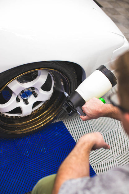 Person using an iK Multi Pro 2 360 on a tire.