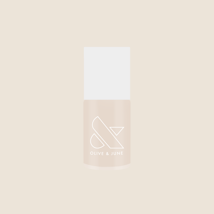 Bottle of Olive and June It's Chilly! quick dry gel polish in a cozy neutral beige shade for mani or pedi.