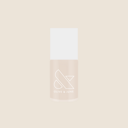 Bottle of Olive and June It's Chilly! quick dry gel polish in a cozy neutral beige shade for mani or pedi.