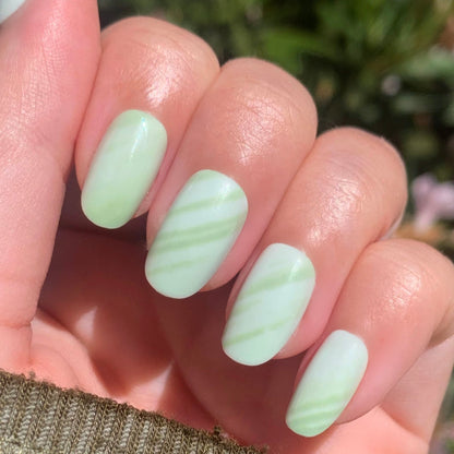 Jade Stone | Round | Short short round press-on nails with soft green jade stripes for an easy at-home manicure
