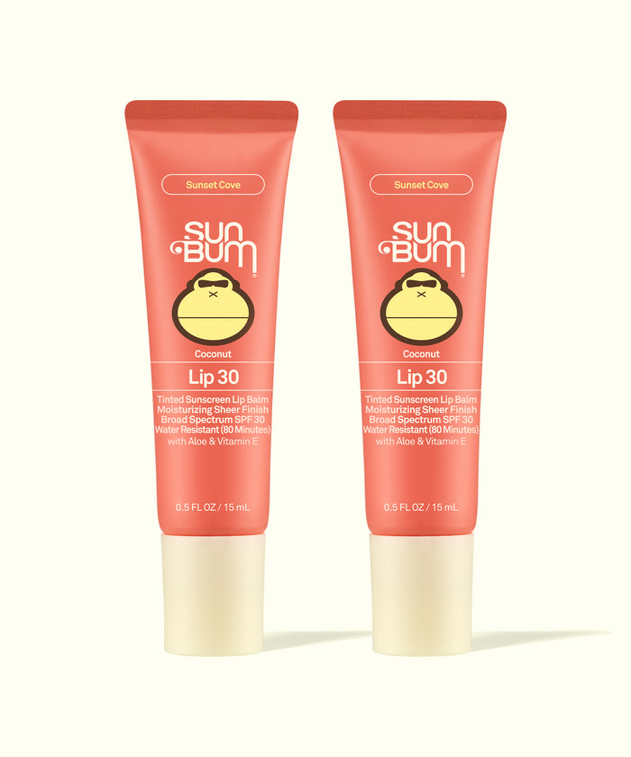 Two Sun Bum Sunset Cove Coconut Lip 30 tinted sunscreen lip balms in coral packaging, part of Tinted Lip Duos