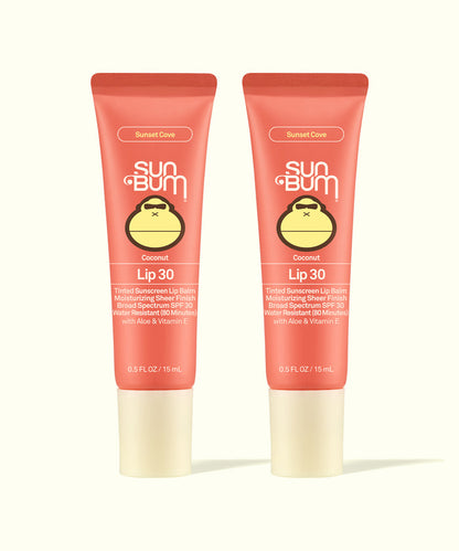 Two Sun Bum Sunset Cove Coconut Lip 30 tinted sunscreen lip balms in coral packaging, part of Tinted Lip Duos