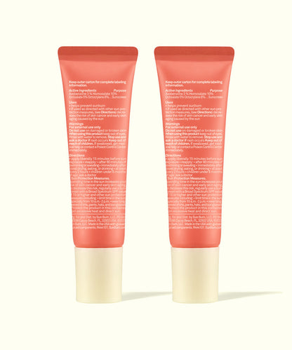 Two coral-colored tubes of Lip 30 Duo: Sunset Cove + Sunset Cove by Sun Bum showing back labels and ingredients.