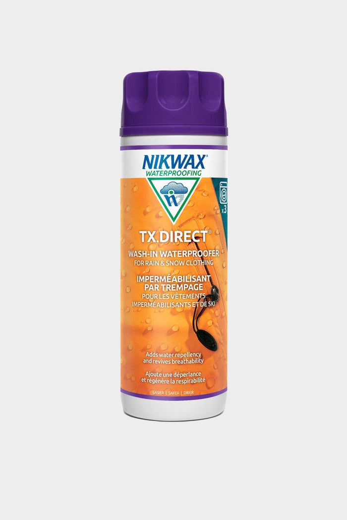 A bottle of 686 Nikwax TX.Direct® Wash-In waterproofing for rain and snow clothing, with orange and blue English and French labeling, and an image of a waterproof jacket.