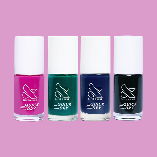 On the Town quick dry polish set with vibrant pink, green, navy, and black shades for a colorful at-home manicure