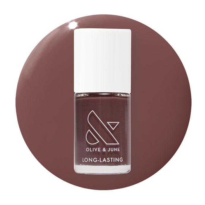 Olive and June Patron of the Arts gel polish bottle on dusty deep rose brown circular background
