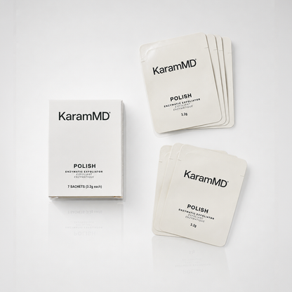 KaramMD Polish Enzymatic Exfoliator skincare set, showing a white product box and multiple individual sachet packets on a clean white background.
