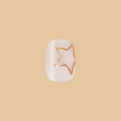 Puffy Gold Stars - Press-On | Extra Short | Squoval nail with milky neutral base and fine glitter star outline design for easy mani