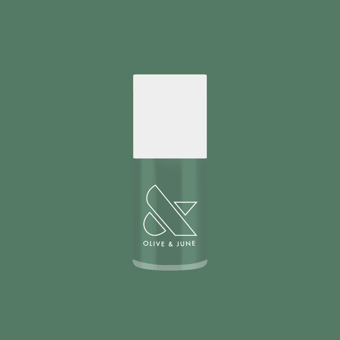 Still Life of Flowers gel polish bottle in cool mossy green shade against solid matching green background