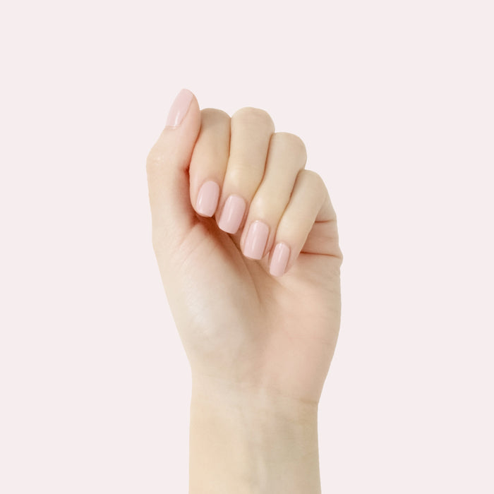 Hand with smooth manicure featuring Study Hall long-lasting polish in vintage rose pink on pale background