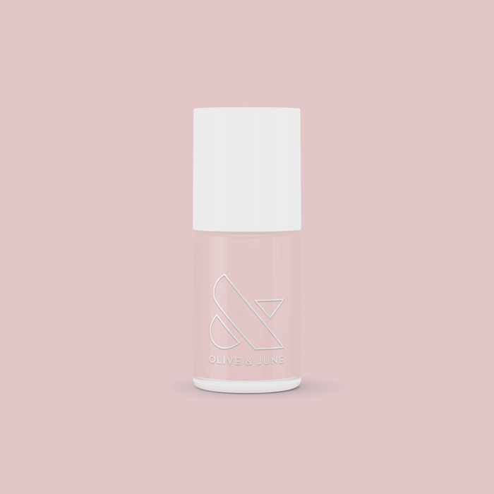 Bottle of Study Hall long-lasting nail polish in soft vintage rose pink on pale pink background