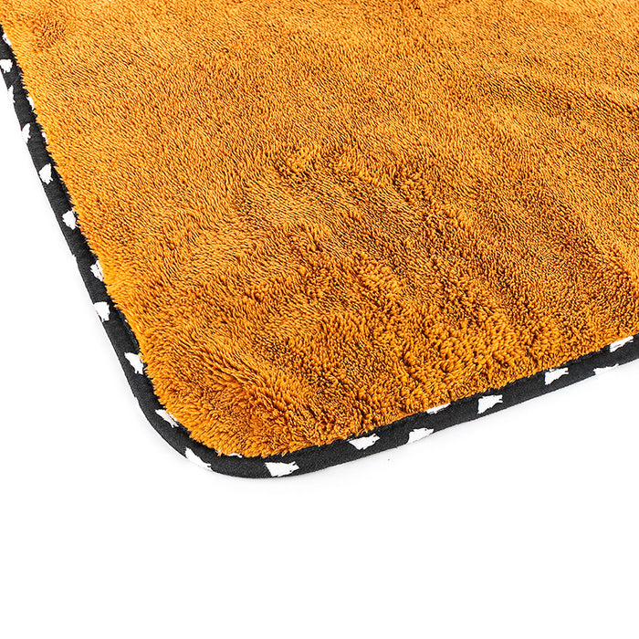 The corner of the brown wolfpack towel on a white background.