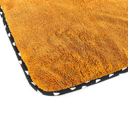 The corner of the brown wolfpack towel on a white background.