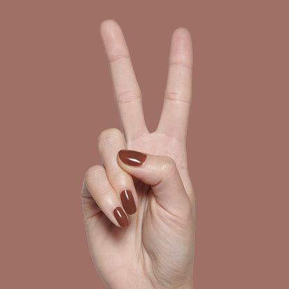 Tip Your Barista | Hand showing peace sign with shiny rich espresso brown long-lasting nail polish manicure