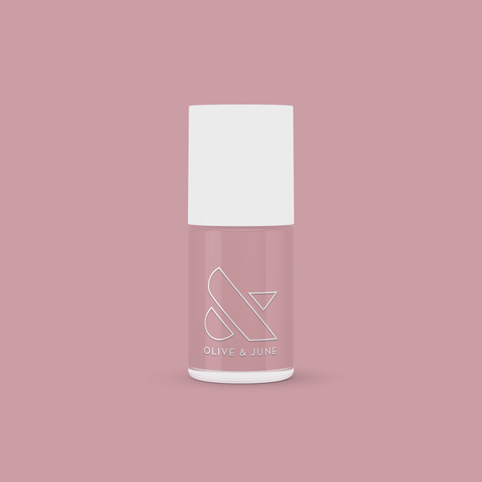 World Lit nail polish bottle with mauve shade on matching mauve background for mani and pedicure use