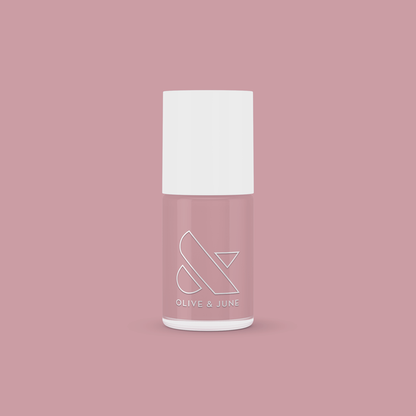 World Lit nail polish bottle with mauve shade on matching mauve background for mani and pedicure use